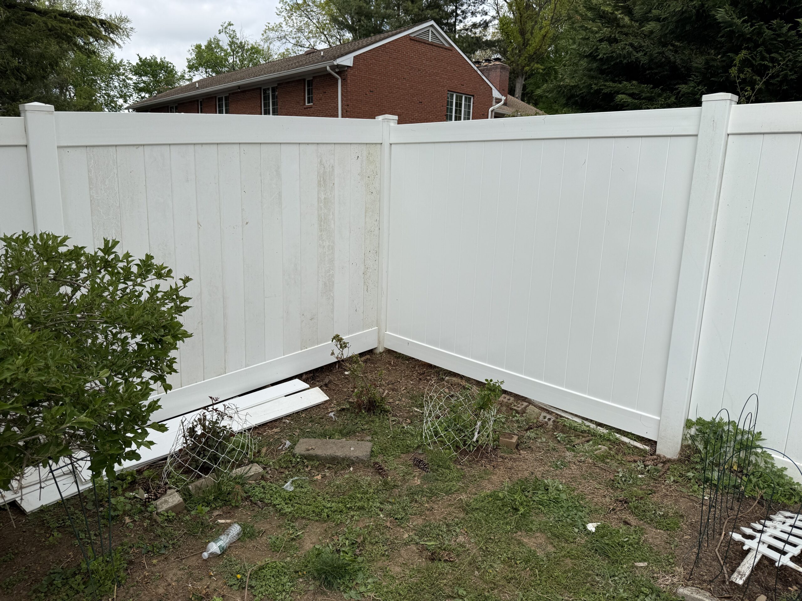White vinyl fence surrounding a yard