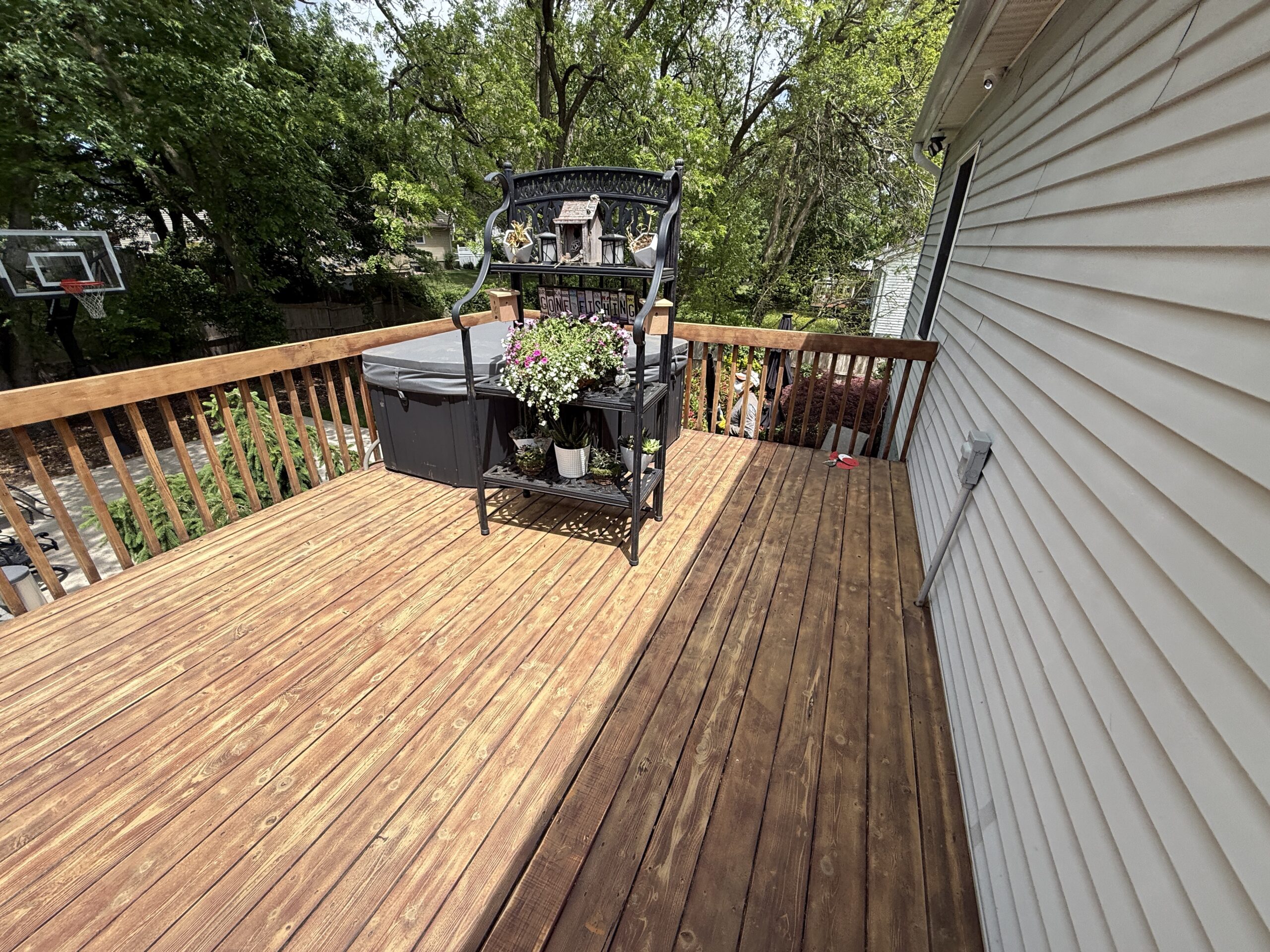 Wood deck with railing and outdoor furniture